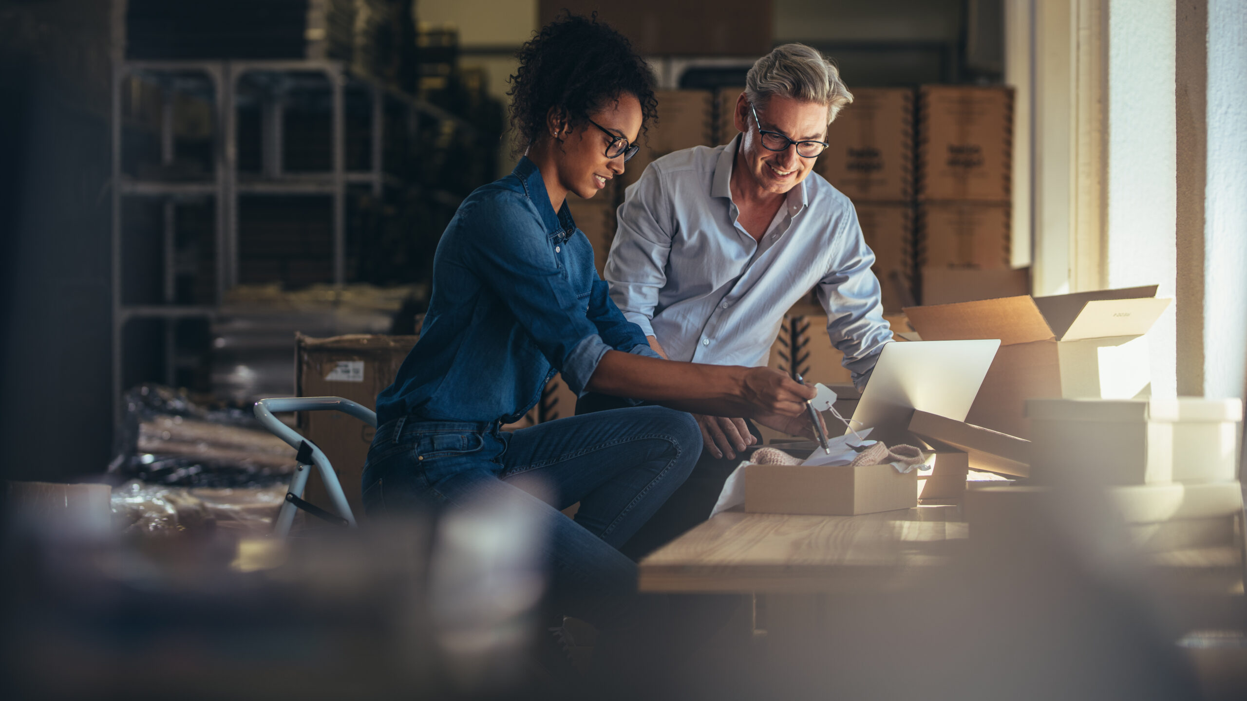 Canadian SME founders discuss working capital while quality checking products.